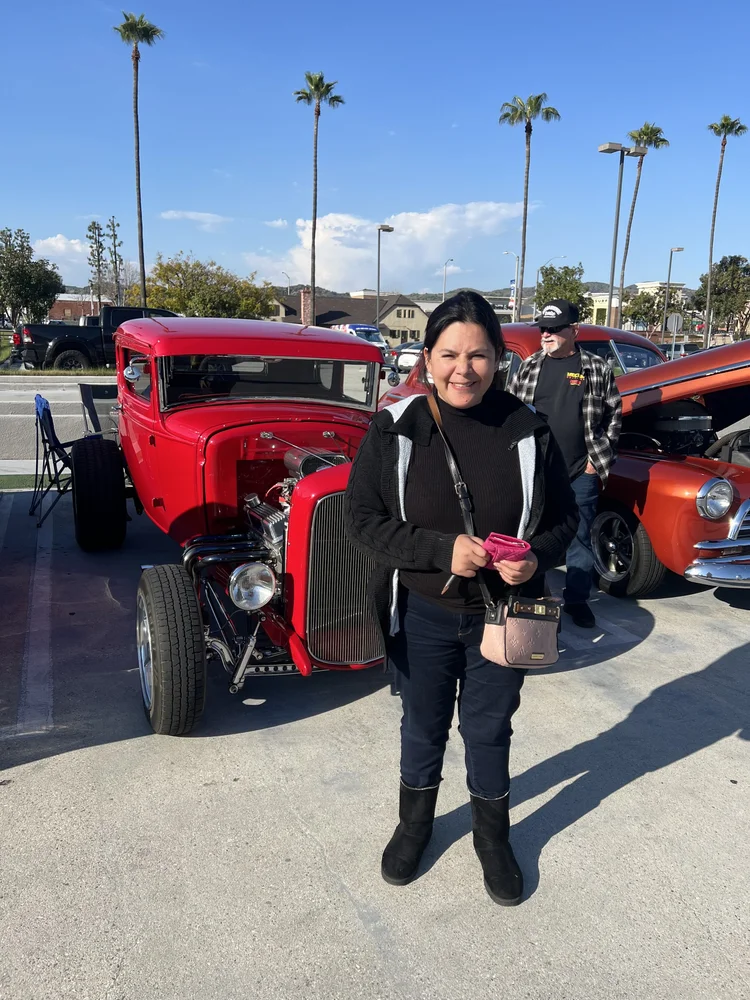 Resident enjoying a community outing at a local car show event